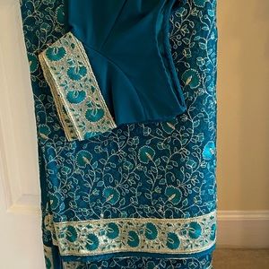 Indian outfit- Saree with matching blouse.